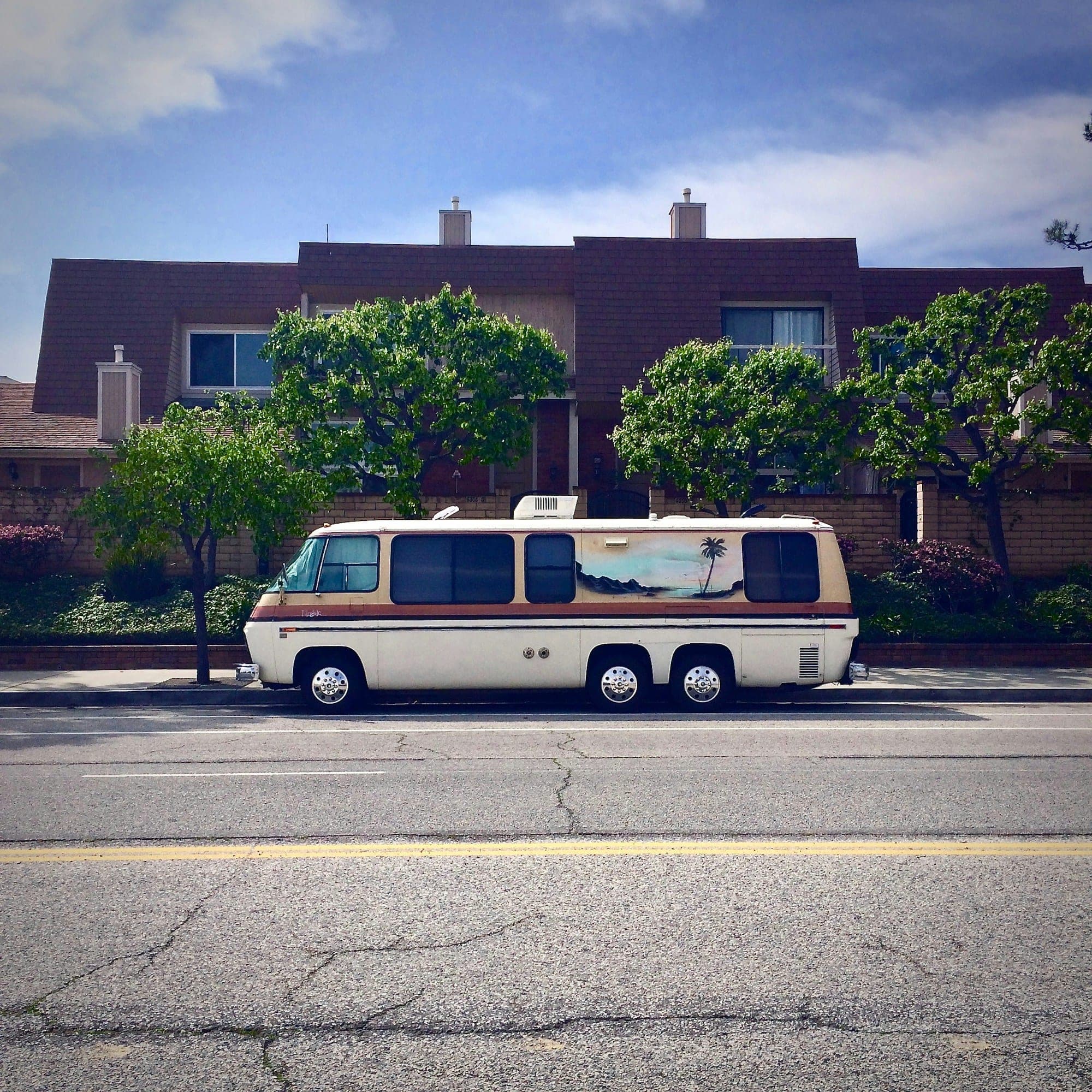 An unmarked white van at the curb — the vehicle a fake locksmith listing usually arrives in