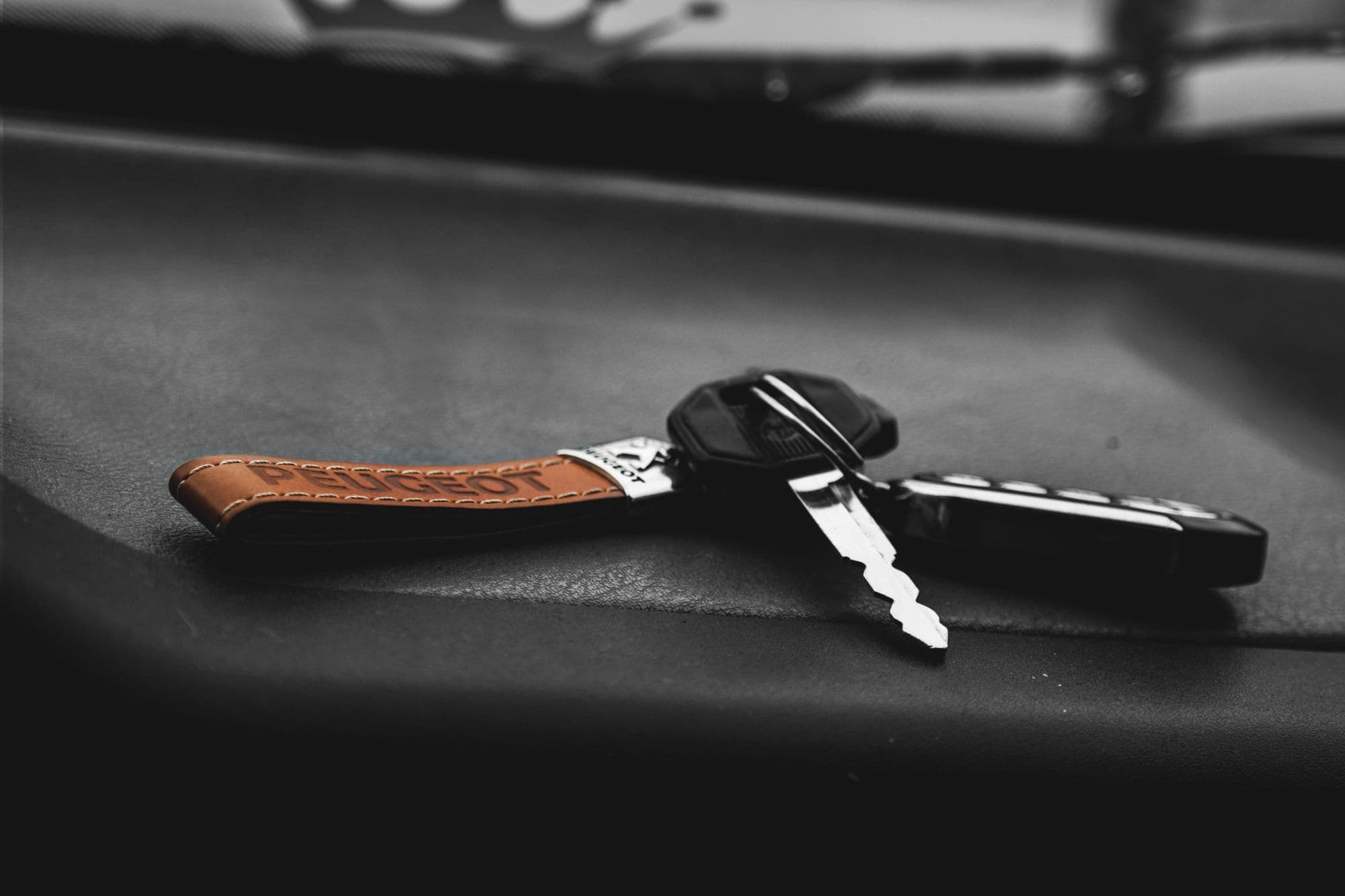 Programmed key fob beside the vehicle
